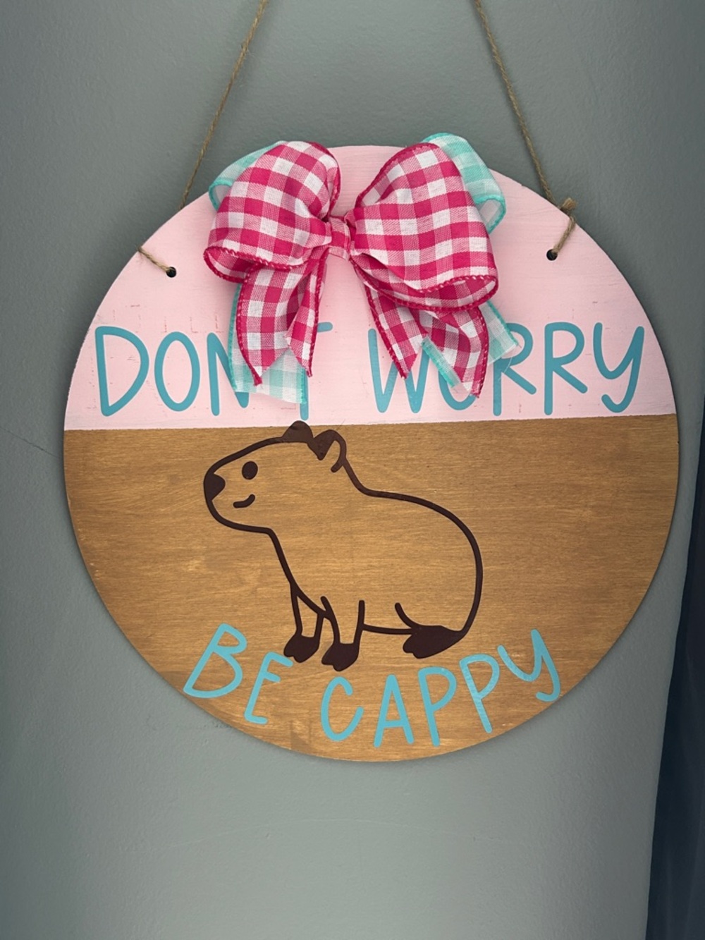 Pink & Teal 'Don't Worry Be Cappy' Round Wall Sign